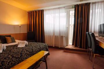 Фото номера Двухместный номер с 1 кроватью или 2 отдельными кроватями Отель Hotelliravintola Kumpu г. Outokumpu 5